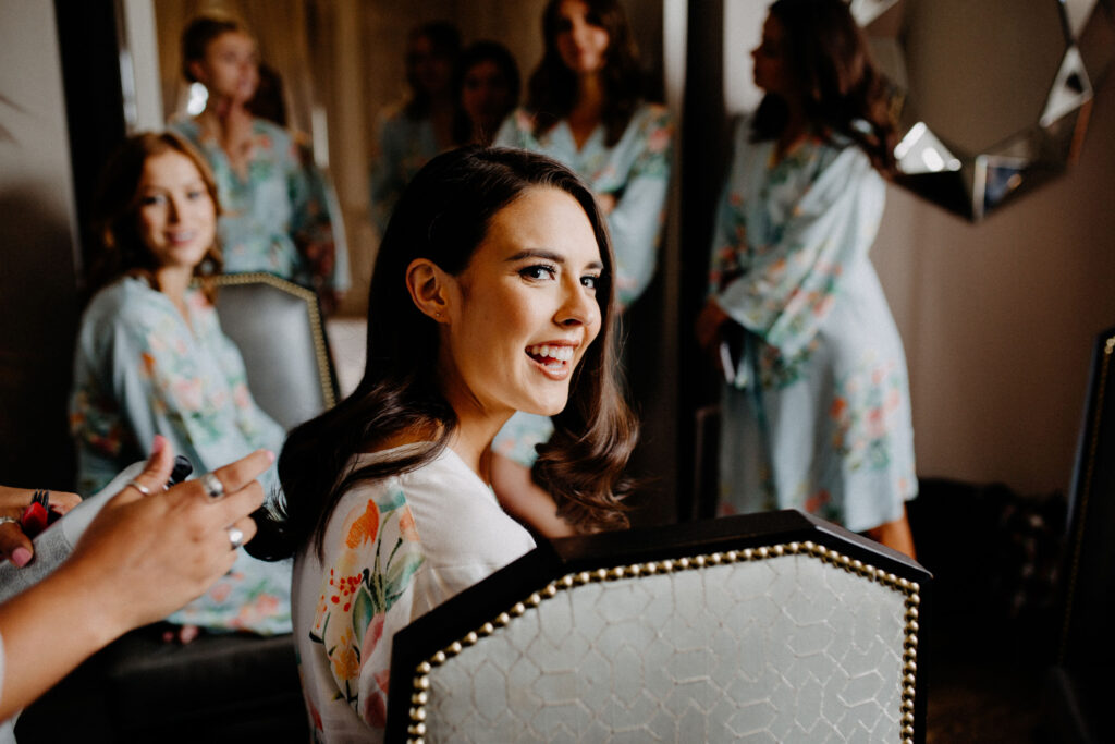 Bride and bridesmaids getting ready at her wedding venue. The St. Anthony in DT San Antonio, TX included in this venue selection guide