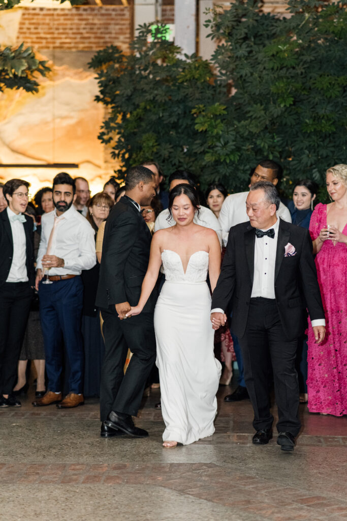 Bride and dancing with their parents at their Valentine DTLA Oasis Wedding 