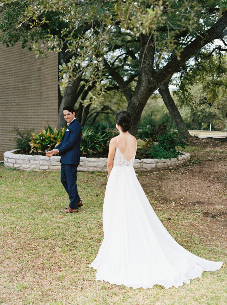 Couples first look at an autumn inspired boho wedding in Hutto, TX with butterscotch details