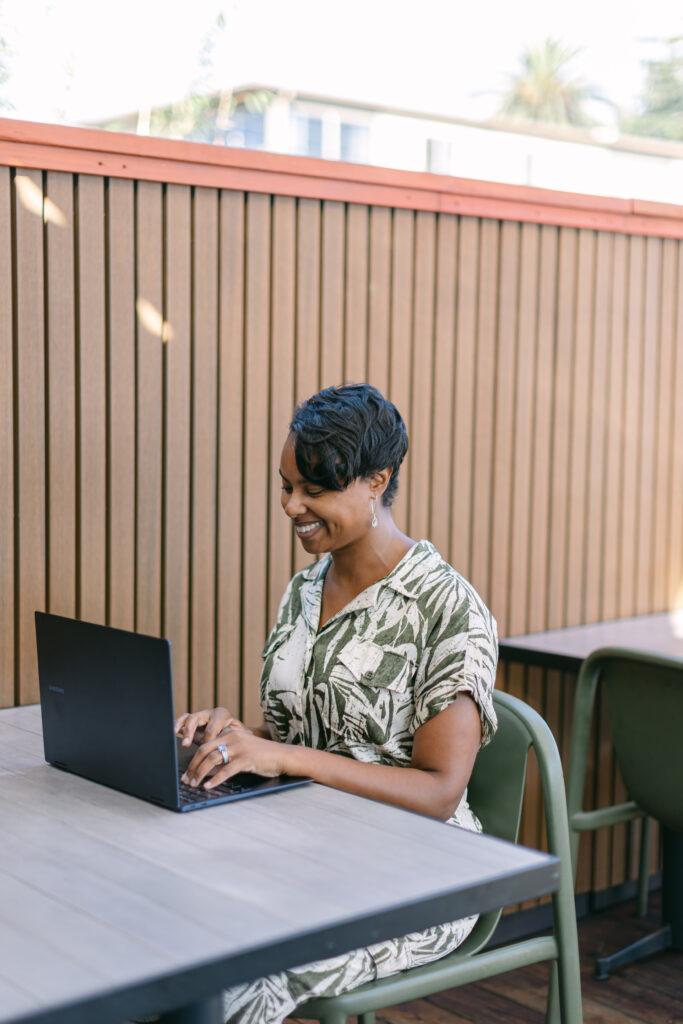 Wedding Planner unravels client's wedding plans while typing on computer